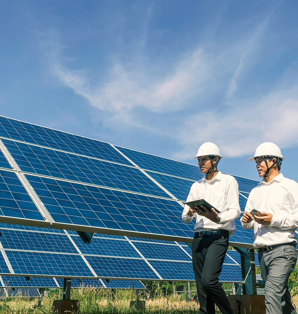 The solar farm(solar panel) with two engineers walk to check the operation of the system, Alternative energy to conserve the world's energy, Photovoltaic module idea for clean energy production.